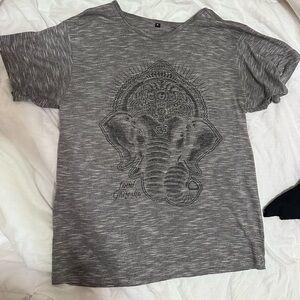 Grey elephant top with lord Ganesha on it. Very soft material